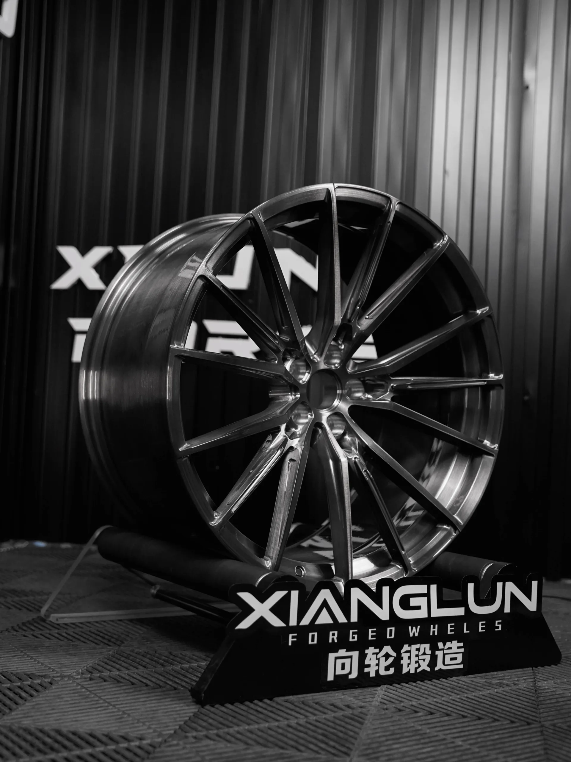 Custom forged single-piece brushed gray multi-spoke wheel