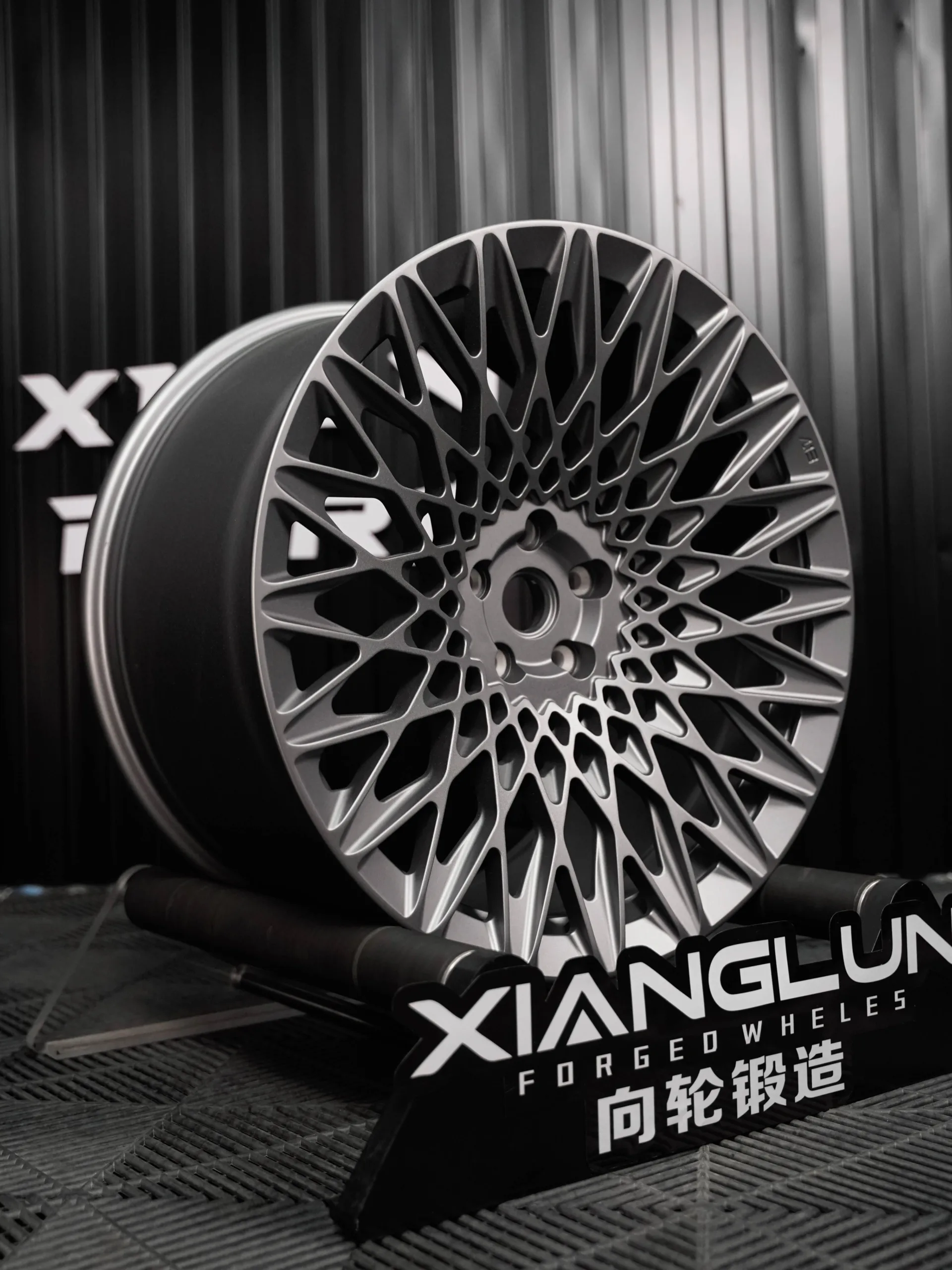 One-piece matte gunmetal gray multi-spoke custom forged wheel