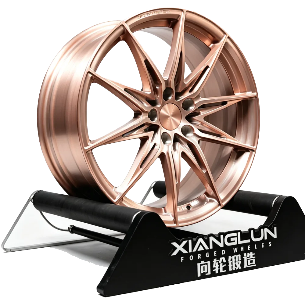 Custom multi-spoke one-piece forged wheels for BMW X6 — brushed rose gold forged finish.